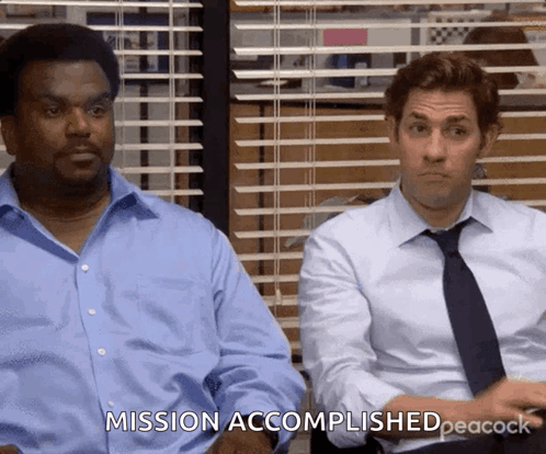 Two Men Are Sitting Next To Each Other And One Of Them Is Saying Mission Accomplished Peacock GIF