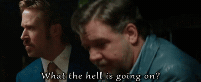 Two Men Are Sitting Next To Each Other And One Of Them Is Saying What The Hell Is Going On . GIF