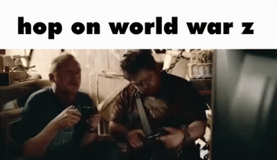 Two Men Are Sitting Next To Each Other In A Room Playing Video Games . GIF