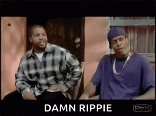 Two Men Are Sitting Next To Each Other In Front Of A Door . GIF