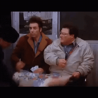 Two Men Are Sitting Next To Each Other On A Subway And Talking . GIF