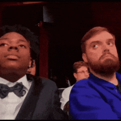 Two Men Are Sitting Next To Each Other With Ohio Stare Written On The Screen GIF