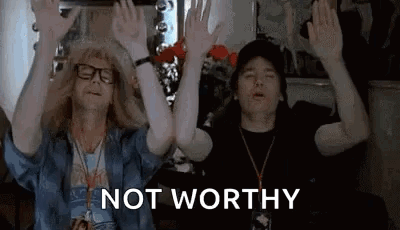 Two Men Are Sitting Next To Each Other With Their Hands In The Air And The Words `` Not Worthy '' . GIF
