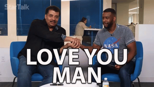 Two Men Are Sitting On A Blue Couch With The Words Love You Man On The Screen GIF
