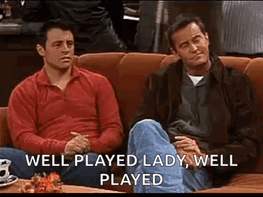 Two Men Are Sitting On A Couch And Talking . GIF