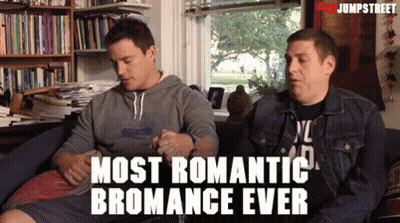 Two Men Are Sitting On A Couch With The Words Most Romantic Bromance Ever GIF