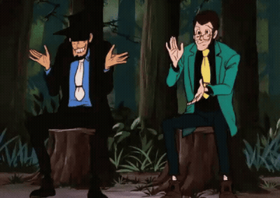 Two Men Are Sitting On A Tree Stump In A Forest . GIF
