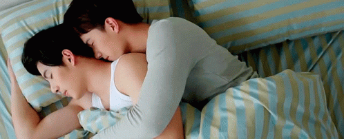 Two Men Sleeping On Striped Sheets Bed GIF