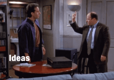 Two Men Are Standing Around A Table With The Words Ideas Written On The Bottom GIF