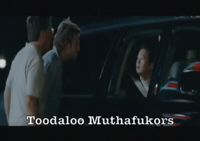 Two Men Are Standing In Front Of A Car With The Words Toodaloo Muthafukukors Written On The Bottom GIF