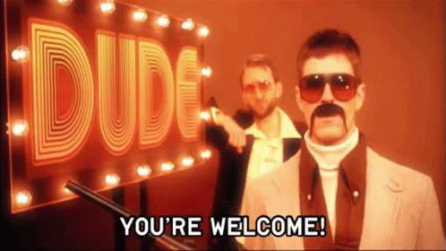 Two Men Are Standing In Front Of A Dude Sign GIF