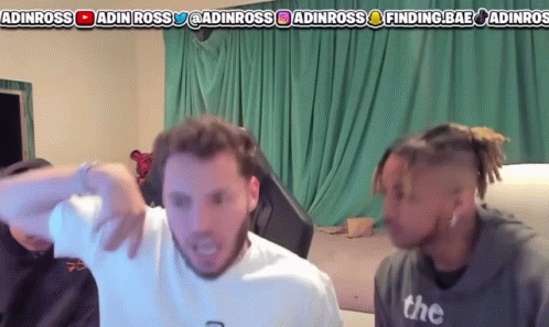 Two Men Are Standing In Front Of A Green Curtain With A Banner That Says ' Adinross ' At The Top GIF