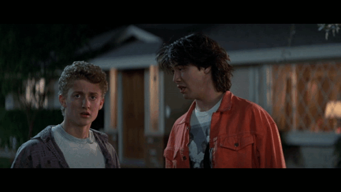 Two Men Are Standing In Front Of A House With The Words This Has Been A Most Unusual Day GIF