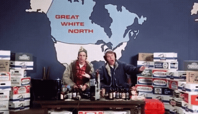 Two Men Are Standing In Front Of A Large Map That Says Great White North GIF