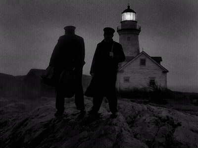 Two Men Are Standing In Front Of A Lighthouse GIF