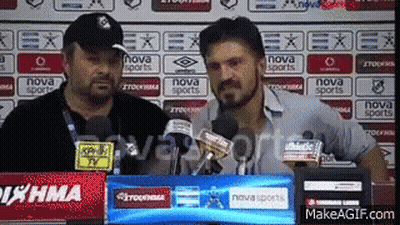 Two Men Are Standing In Front Of A Nova Sports Sign GIF