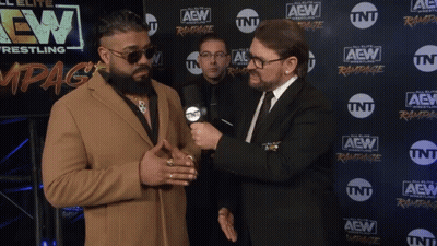 Two Men Are Standing In Front Of A Wall With Aew Wrestling Written On It GIF