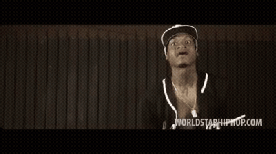 Two Men Are Standing In Front Of A Wooden Wall And The Words Worlds Of Hiphop.com Are On The Bottom Of The Screen GIF