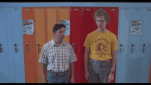 Two Men Are Standing In Front Of Lockers And One Of Them Is Wearing A Yellow Shirt That Says Rick College GIF