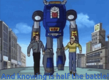 Two Men Are Standing Next To A Giant Robot That Says And Knowing Is Half The Battle GIF