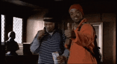 Two Men Are Standing Next To Each Other And Giving A Thumbs Up GIF