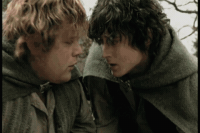 Two Men Are Standing Next To Each Other And Looking At Each Other With Their Eyes Closed . GIF