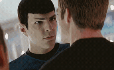 Two Men Are Standing Next To Each Other And Looking At Each Other With Their Eyes Closed . GIF