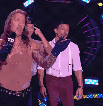 Two Men Are Standing Next To Each Other And One Has A Microphone That Says Tbc On It GIF