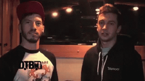 Two Men Are Standing Next To Each Other And One Has A Shirt That Says Yahoo On It GIF