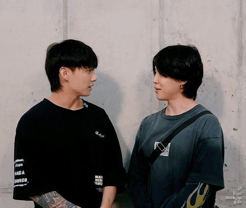 Two Men Are Standing Next To Each Other And One Has A Tattoo On His Arm That Says ' I Love You ' On It GIF