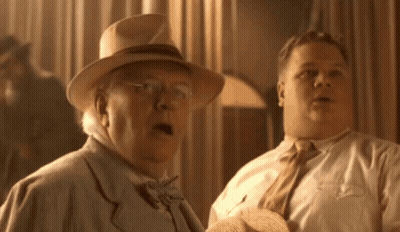 Two Men Are Standing Next To Each Other And One Has His Mouth Open GIF