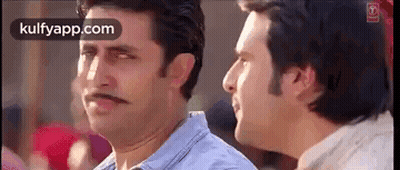 Two Men Are Standing Next To Each Other And One Of Them Has A Mustache On His Face . GIF