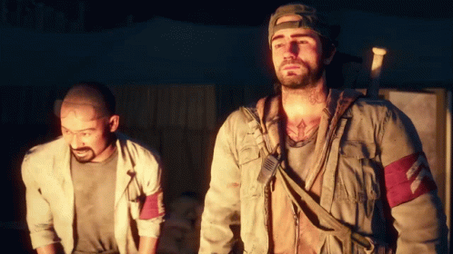 Two Men Are Standing Next To Each Other And One Of Them Has A Tattoo On His Chest GIF