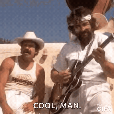 Two Men Are Standing Next To Each Other And One Of Them Is Holding A Guitar . GIF