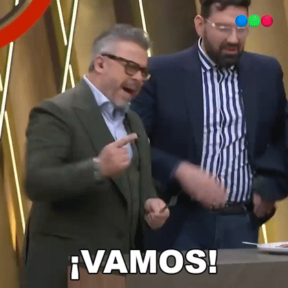 Two Men Are Standing Next To Each Other And One Of Them Is Pointing And The Other Is Saying Vamos ! GIF