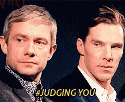 Two Men Are Standing Next To Each Other And One Of Them Is Saying # Judging You . GIF
