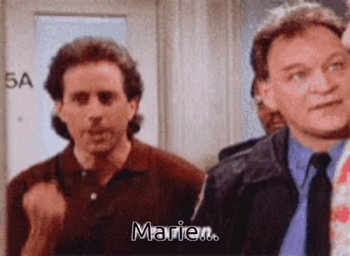 Two Men Are Standing Next To Each Other And One Of Them Is Saying " Marie " GIF