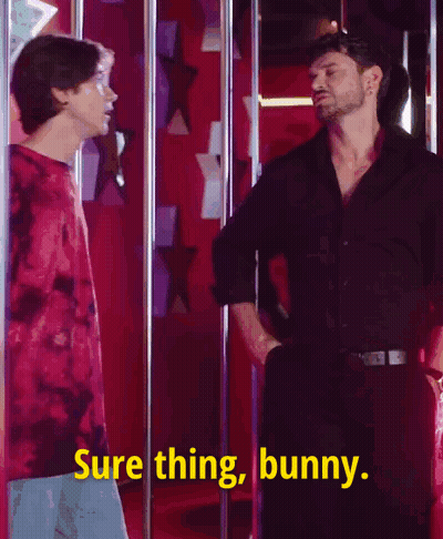 Two Men Are Standing Next To Each Other And One Of Them Is Saying Sure Thing Bunny . GIF