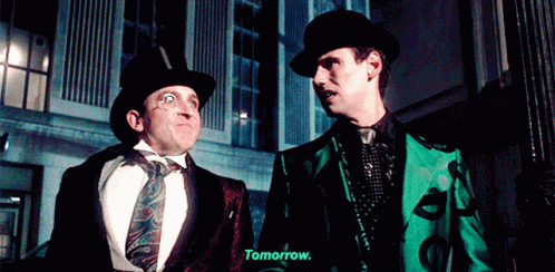 Two Men Are Standing Next To Each Other And One Of Them Is Saying " Tomorrow " GIF