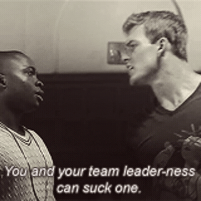 Two Men Are Standing Next To Each Other And One Of Them Is Saying You And Your Team Leader-Ness Can Suck One GIF