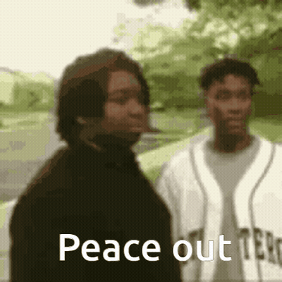 Two Men Are Standing Next To Each Other And One Of Them Is Smoking A Cigarette And The Other Is Smoking A Cigarette . GIF