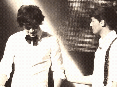 Two Men Are Standing Next To Each Other And One Of Them Is Wearing A Bow Tie GIF