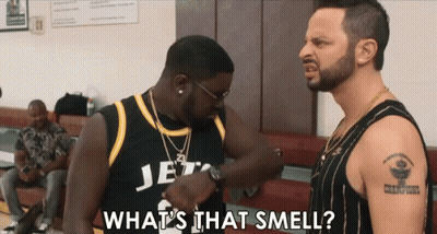 Two Men Are Standing Next To Each Other And One Of Them Is Wearing A Jersey That Says Jets GIF