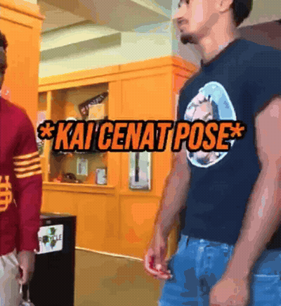 Two Men Are Standing Next To Each Other And One Of Them Is Wearing A Kai Cenat Pose Shirt GIF