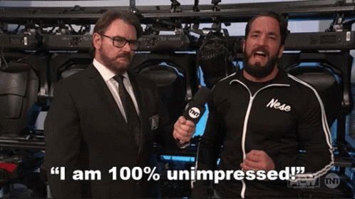Two Men Are Standing Next To Each Other And One Of Them Is Wearing A Shirt That Says Nese On It GIF