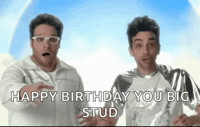 Two Men Are Standing Next To Each Other And One Of Them Is Wearing Glasses And The Other Is Wearing A Silver Shirt . GIF