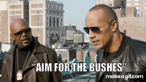 Two Men Are Standing Next To Each Other And One Of Them Says Aim For The Bushes GIF