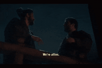 Two Men Are Standing Next To Each Other And One Of Them Says We 'Re Allies GIF