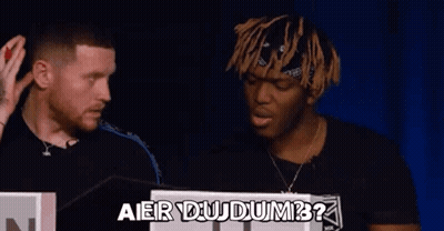 Two Men Are Standing Next To Each Other And Talking . GIF