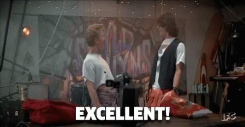 Two Men Are Standing Next To Each Other And The Word Excellent Is On The Table GIF